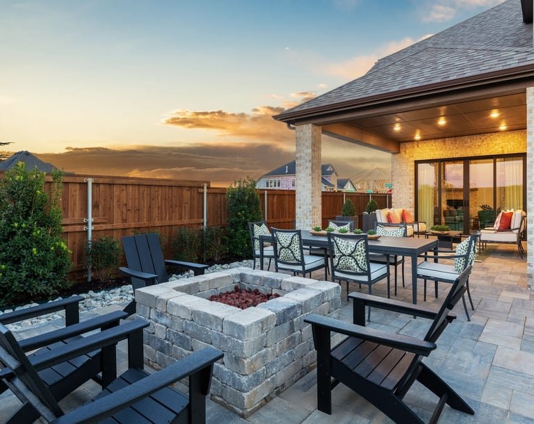 Backyard fire pit and outdoor living area at dusk