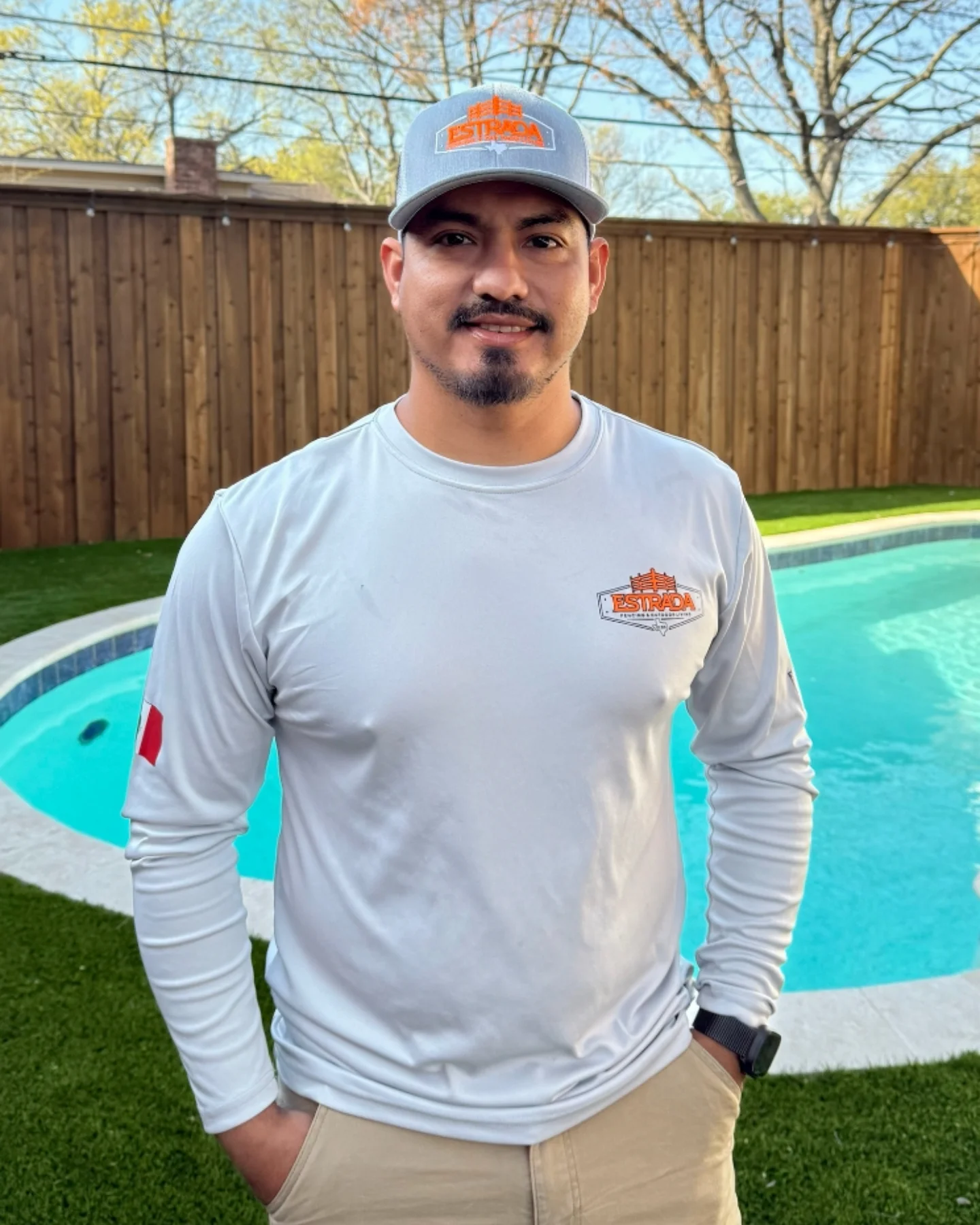 Jorge Estrada, owner of Estrada Fencing & Outdoor Living, at a finished Dallas County backyard